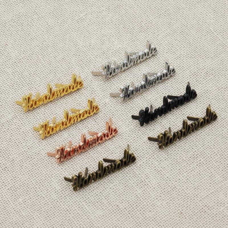 Sewing Labels - 10 قطع من الملصقات المعدنية اليدوية